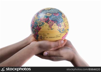 Two hands holding a globe in hand on white background