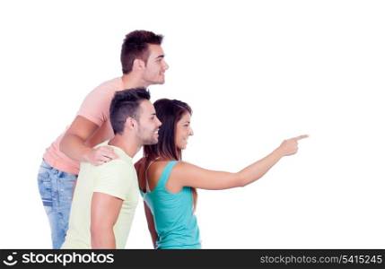 Two handsome boys with a beautiful girl indicating somthing isolated on a white background