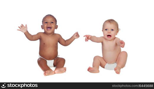 Two happy babies of different races isolated on a white background