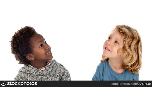 Two happy children looking up isolated on a white backround