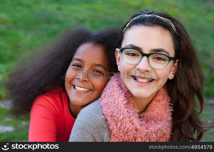 Two happy girls friends in the park