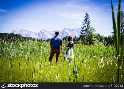 Two happy lovers on Holiday in the alps mountains