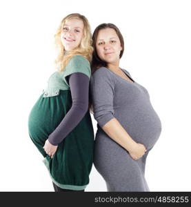 Two happy pregnant women waiting for the birth of their babies isolated on white background. Two pregnant women