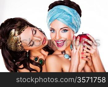 Two Happy Women holding Apple - Healthy Food concept