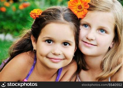 two happy young girls children have fun outdoor in nature