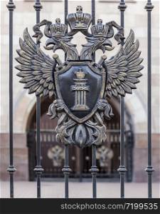 "Two-headed eagle with a shield, where it is written "Law""