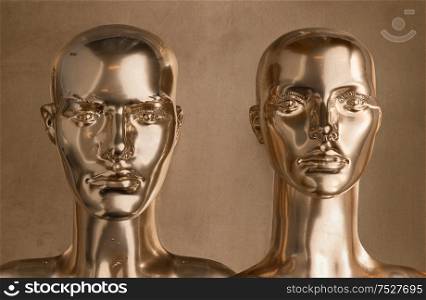 Two heads of human golden scupltures