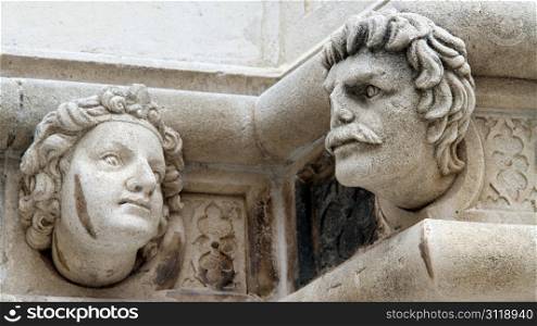 Two heads on the corner of cathedrale in Shibenik, Croatia