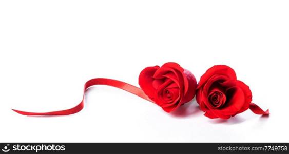 Two heart shaped red roses and ribbons isolated on white background, Valentines day. Two heart shaped red roses