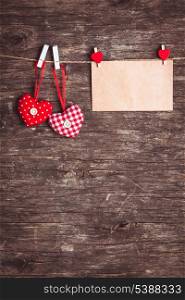 Two hearts and craft envelope .attached to the rope. Valentine greetings