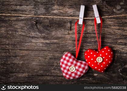 Two hearts attached to the rope. Valentine greetings