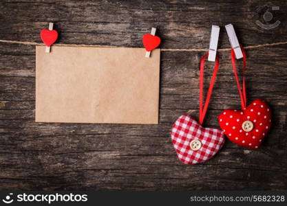 Two hearts attached to the rope. Valentine greetings