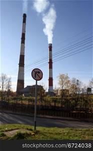 Two high chimneys and road in Murmansk, Russia