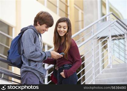Two High School Students Standing Outside Building