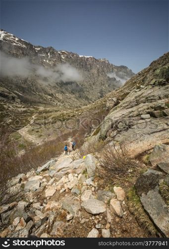 Two hikers in the Mountains of Restonica near Corte in Corsica