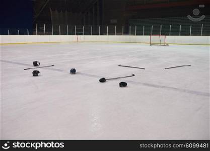 two hockey sticsk and puck on ice, start of the game, competition concept in business, top view