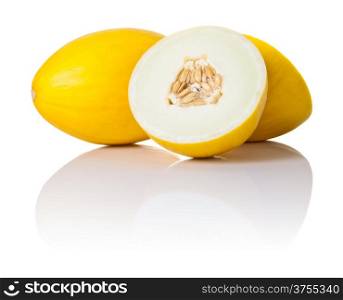 Two honeydew melons on white background. One sliced in half and second whole, copy space