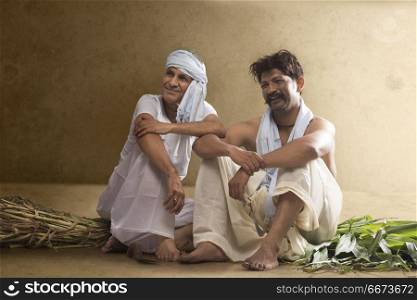 Two Indian farmer sitting together