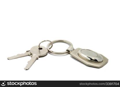 Two keys on a charm. It is isolated on a white background