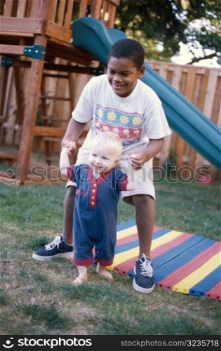 Two Kids Playing in Yard