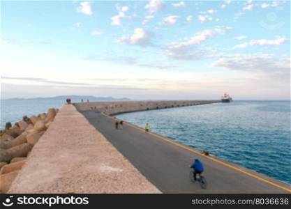 Two-kilometer stone breakwater protecting harbor of Heraklion.. Heraklion. Breakwater in the seaport.