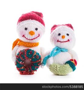 Two knitted christmas snowmen isolated on white