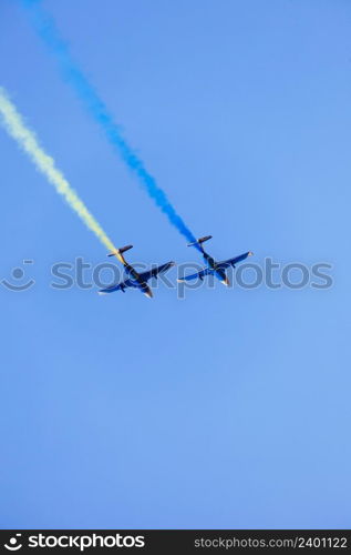 Two L-29 jet planes draw the flag of Ukraine. Kharkov. AviaFest 2021