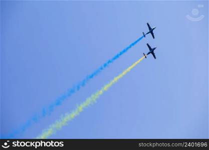 Two L-29 jet planes draw the flag of Ukraine. Kharkov. AviaFest 2021