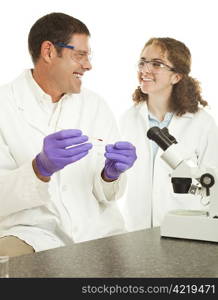 Two lab techs enjoy working on a blood sample together. Isolated on white.