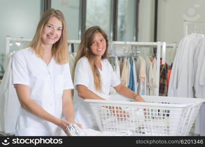 Two ladies working in a laundry