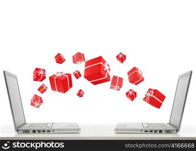 two laptops are sharing red gift boxes by air