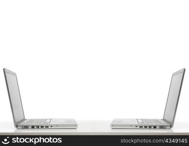 two laptops opposite each other isolated on white