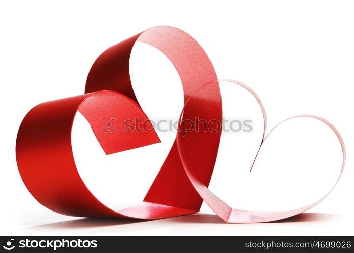 Two linked hearts of red ribbon isolated on white background
