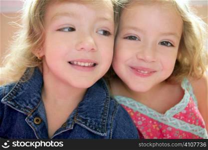 Two little beautiful toddler twin sisters portrait