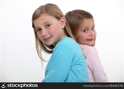 two little girls posing together