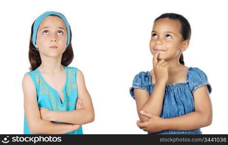 Two little girls thinking on a over white background
