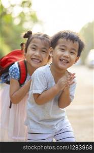 two lovely asian children boy and girl with kidding smiling face