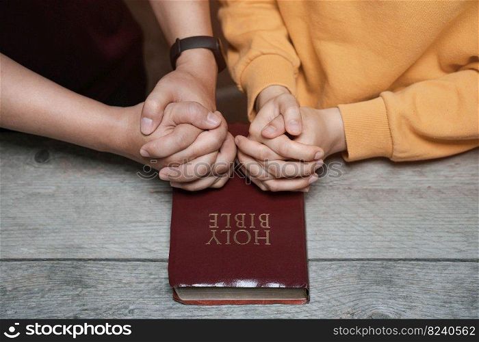 two lovers sitting and praying bible Thank God for living with the blessings of God. in the Christian religion