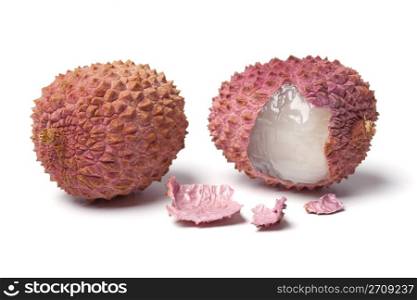 Two lychees on white background