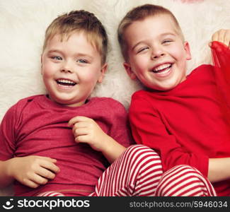 Two lying and laughing brothers