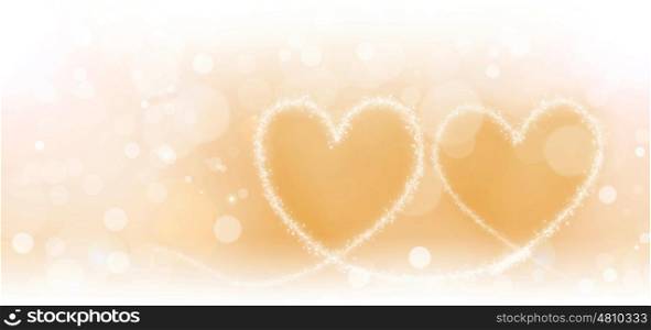 Two magic hearts. Two magic hearts of glowing lights on golden background