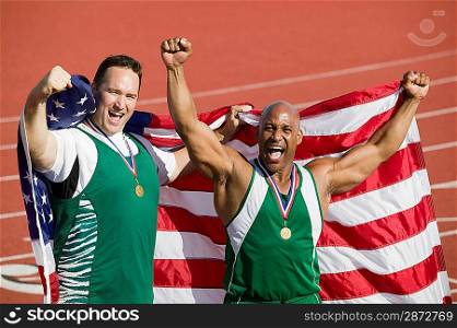 Two male athletes enjoying victory, portrait