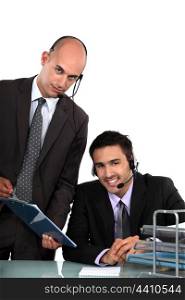 Two male call-center workers