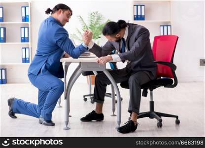 Two male colleagues in the office