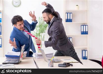 Two male colleagues in the office 