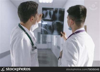 two male doctors looking x ray. High resolution photo. two male doctors looking x ray. High quality photo
