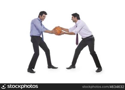 Two male executives holding a basketball