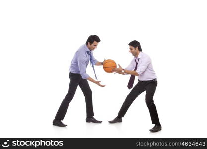 Two male executives playing basketball