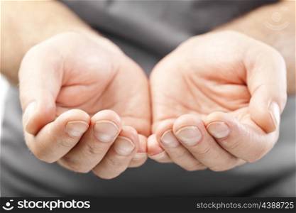 two male hands as if giving, showing or holding concept