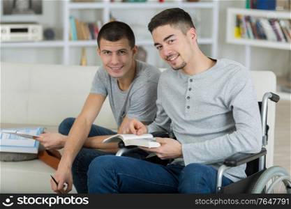 two male students looking into the camera while they smile